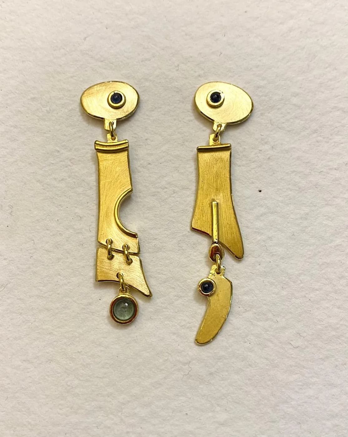 Gold earrings with a gemstone
