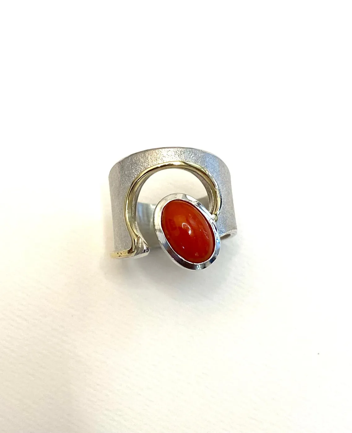 Silver ring with a red stone