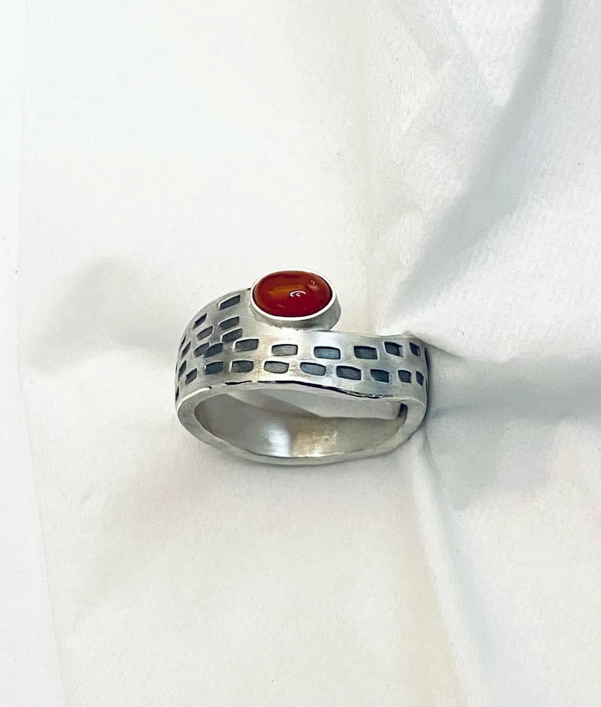 Silver ring with a red stone
